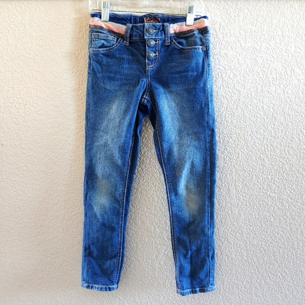 Like new girls jeans with decorative waist band